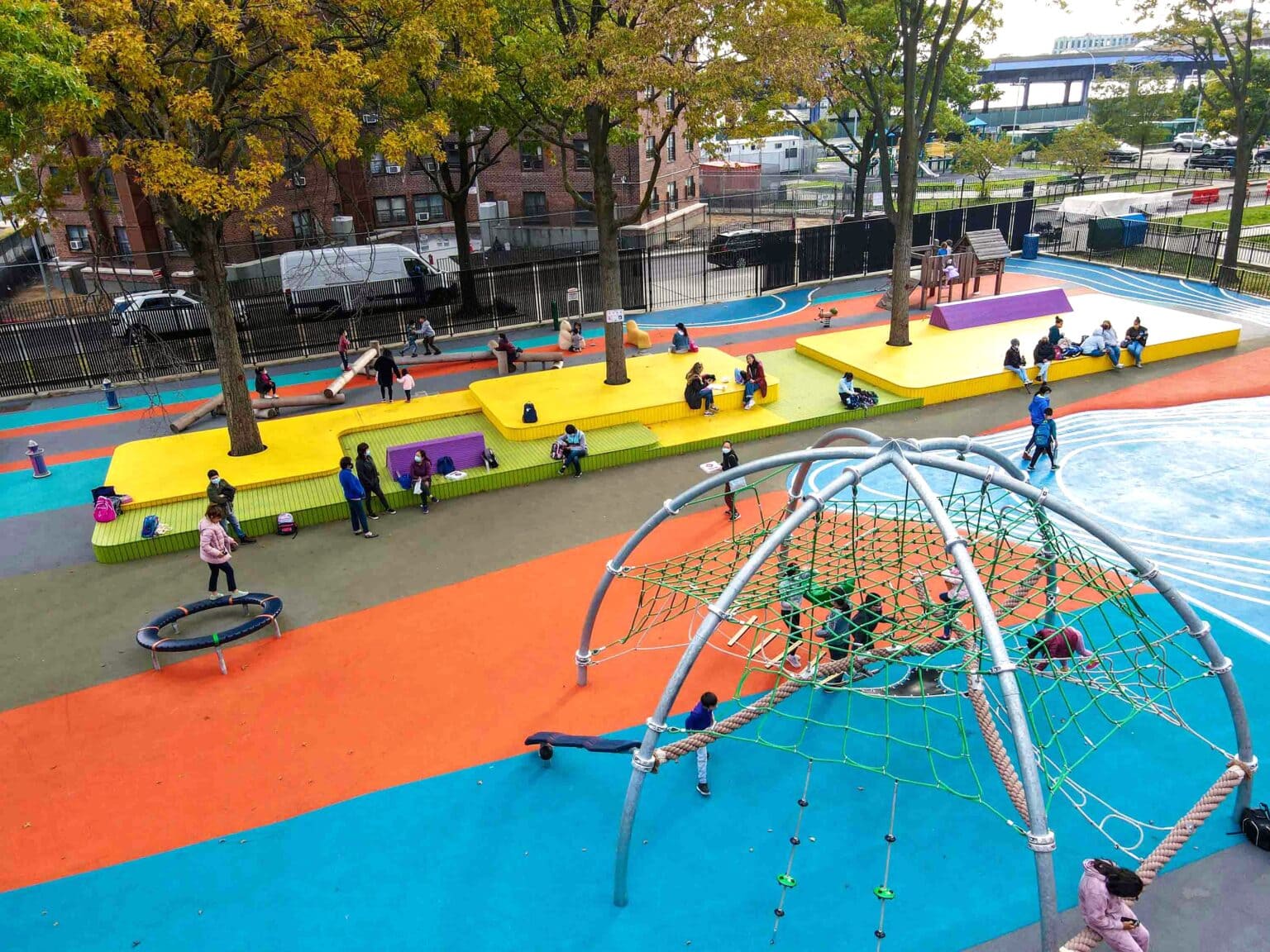 Aerial of playground and colorful seating platform.